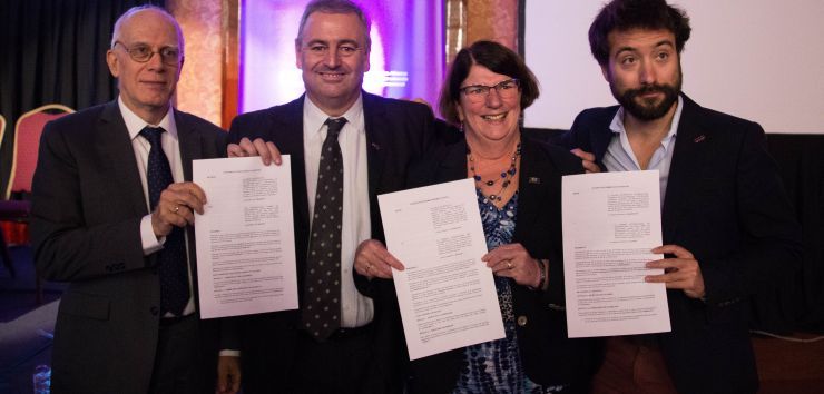 Signature by the Chair of the ICA Youth Network, Sebastien Chaillou, the Executive Director of Cooperative and Mutuals Canada, Denyse Guy and the Director General of the ICA, Bruno Roelants.